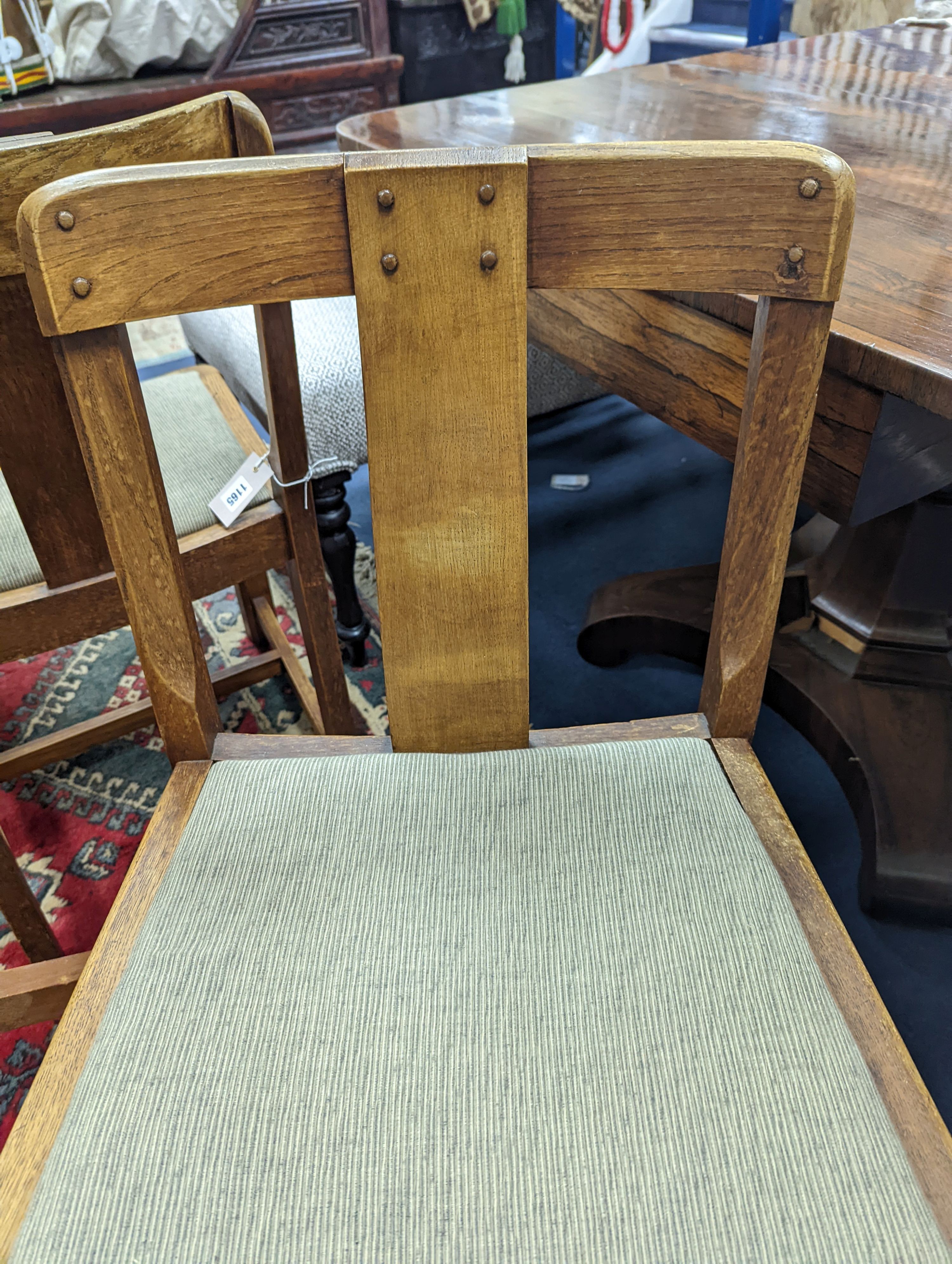 A pair of Arts and Crafts oak side chairs, outer Hebrides